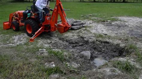 how to dig a hole with a mini excavator|kubota mini trench digging.